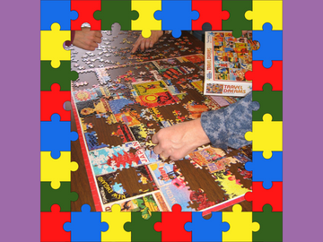 photo of people putting a puzzle together