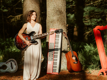 photo of Kala Farnham with musical instruments