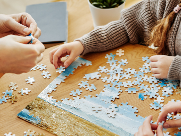 photo of people putting together a puzzle