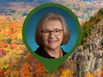 Photo of Trina Learned in a map point frame with sleeping giant state park photo in background